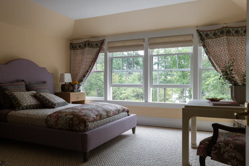 Image portraying window replacement cost in bedroom with triple double-hung white windows