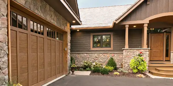 Image of ProVia Aeris vinyl casement window on craftsman home with stone and wood siding