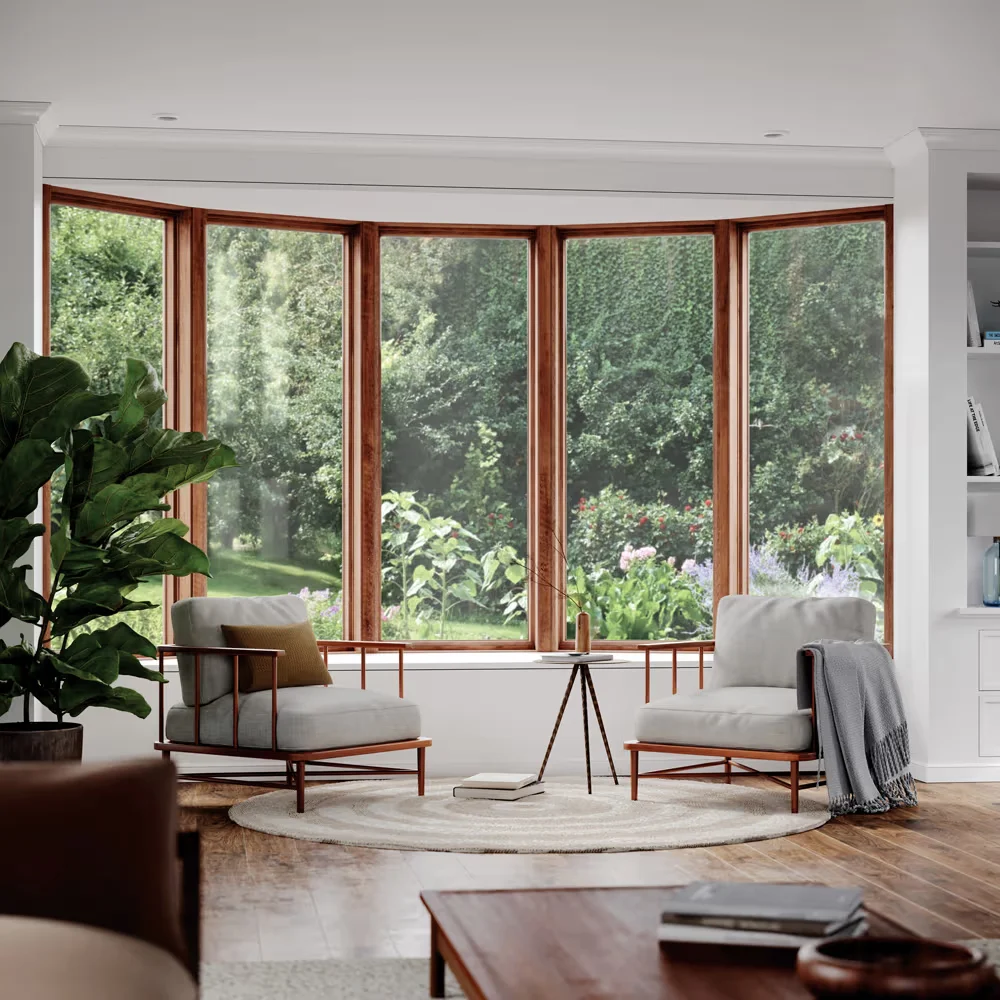 Image of a living room bow window with warm wood frames reflecting marvin windows benefits