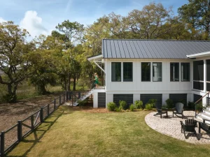Image of Marvin windows on a coastal home exterior with board-and-batten siding and metal roof