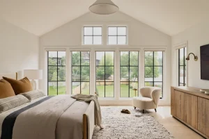 Image of are Marvin windows worth the price shown in a bright bedroom with black-grid casement windows and vaulted ceiling