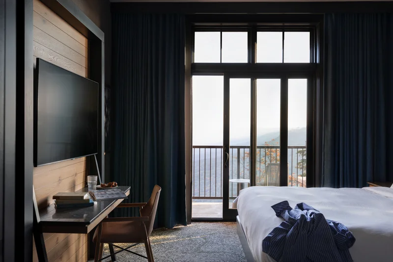 Image of a modern sliding glass door leading to a balcony