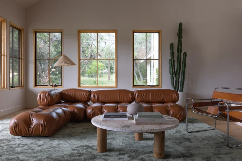 Image of a living room with wood-trimmed windows illustrating Marvin Elevate vs Essential styles