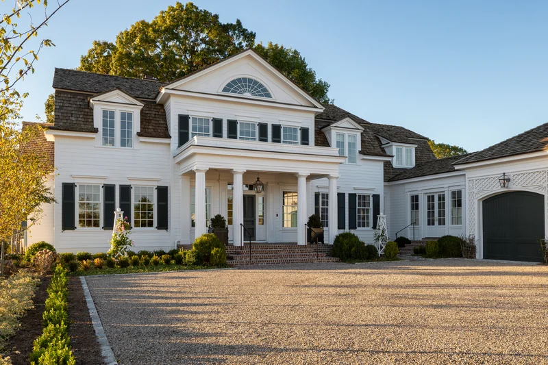Image of a white colonial home entrance after front door replacement
