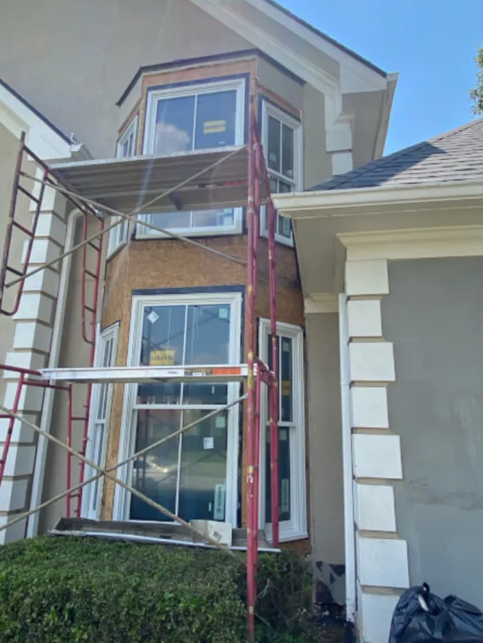 Marvin Ultimate replacement windows installed in a two-story bay on a Duluth home