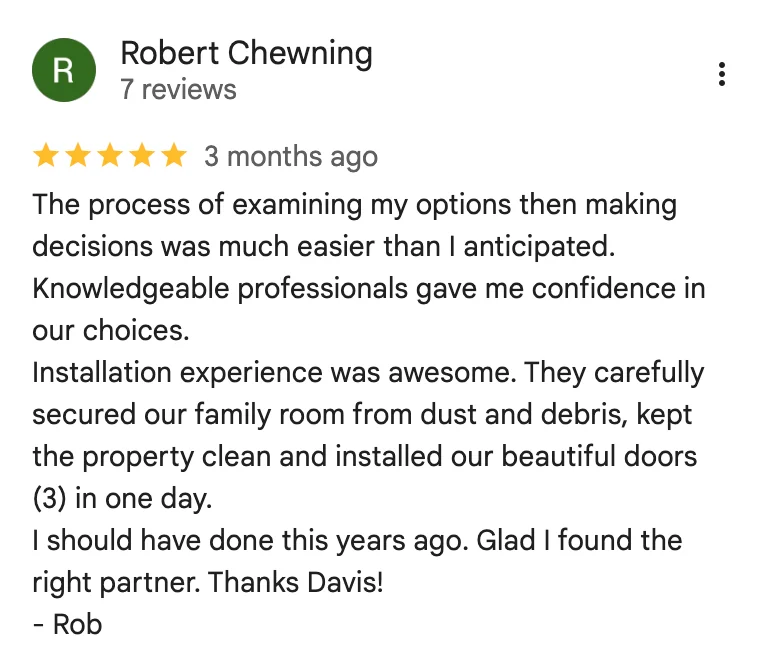 Screenshot of a 5-star review by Robert Chewning praising Davis Window and Door's clean, efficient door installation